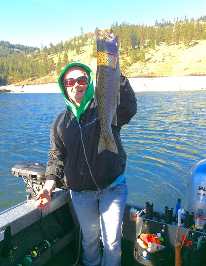 Rainbow trout being held up